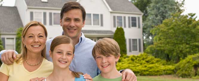 Family in front of house